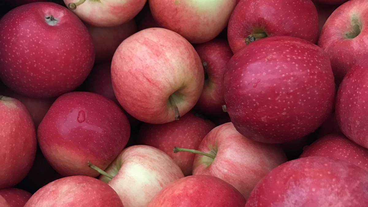 Red apples on a wooden table
