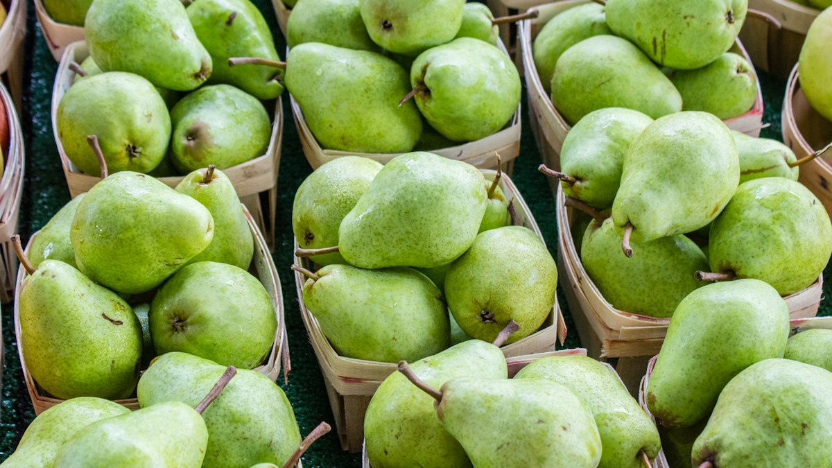 Ripe pears on a wooden surface