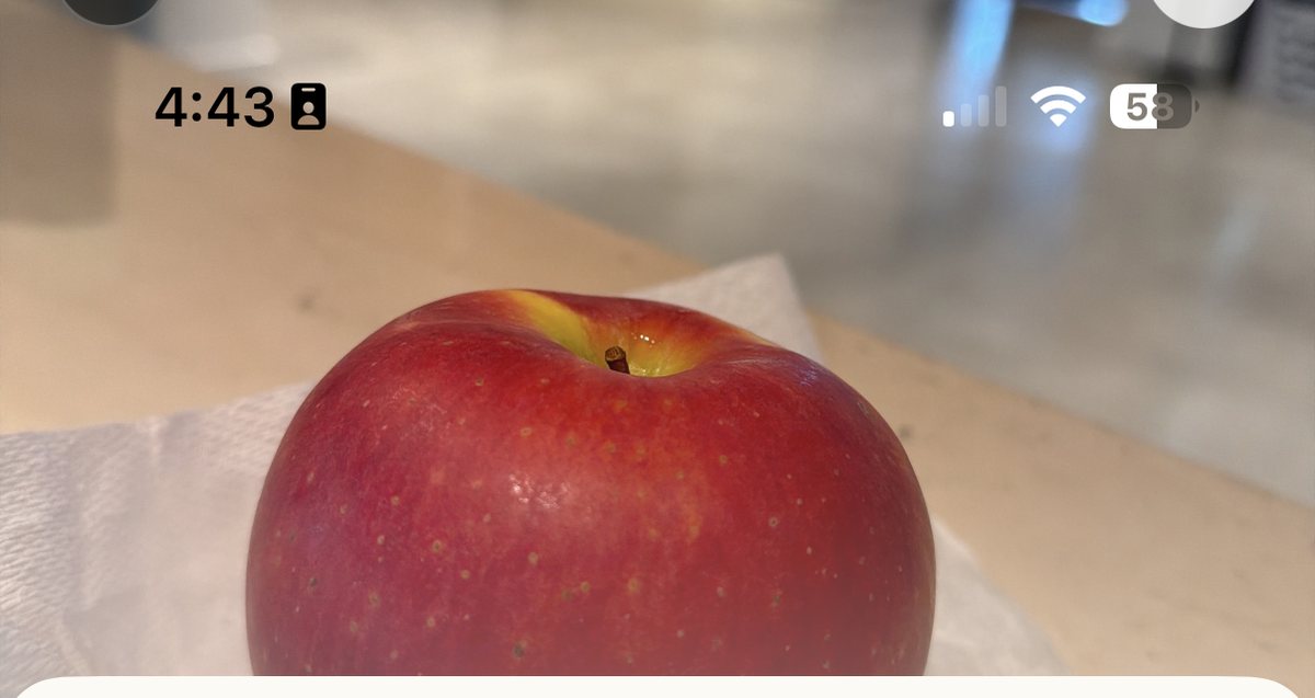 A red apple on a kitchen counter, photographed in the PluckFresh app